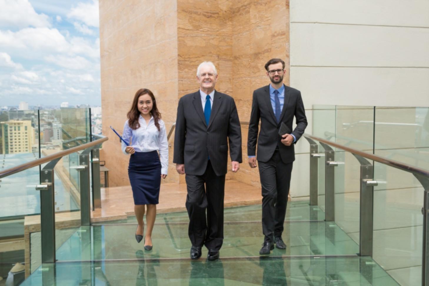 Professional discussing investment strategies with market charts